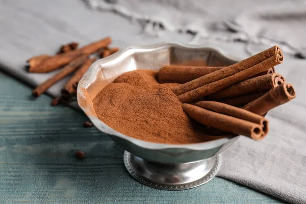 Bowl Aromatic Cinnamon Powder Sticks Wooden Background — Stock Photo, Image