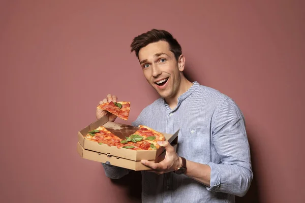 Attractive Young Man Delicious Pizza Color Background — Stock Photo, Image