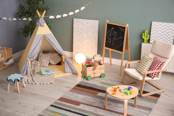 Modern room interior with play tent for child