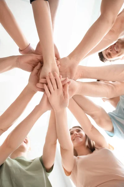 People Putting Hands Together Light Background Closeup Unity Concept — Stock Photo, Image