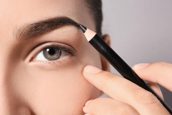 Young Woman Correcting Eyebrow Shape Pencil Closeup — Stock Photo, Image