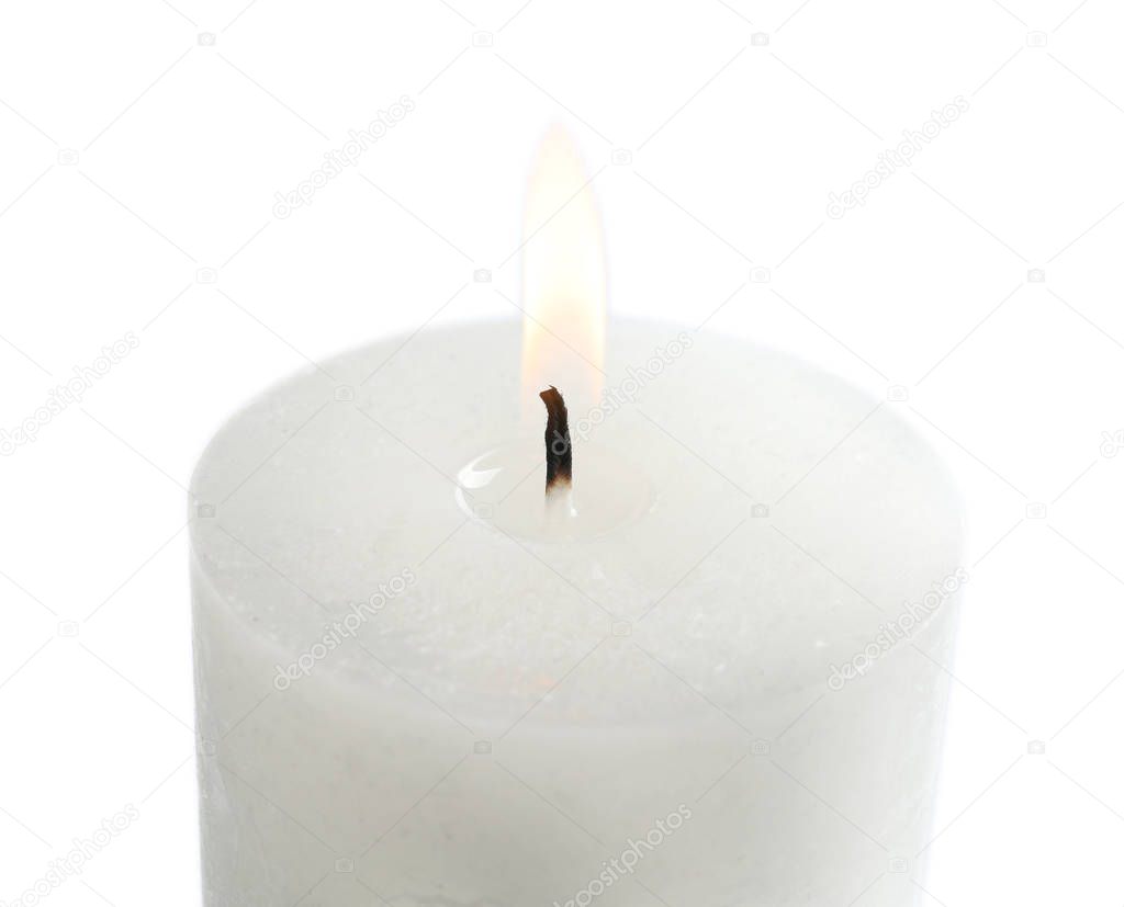 Burning wax candle on white background, closeup