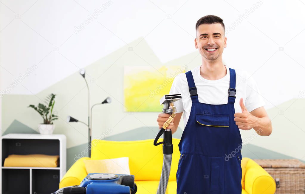 Dry cleaning worker with professional apparatus indoors