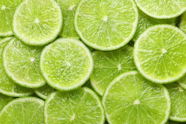 Arka plan olarak, üstten görünüm olgun limes dilimlenmiş taze