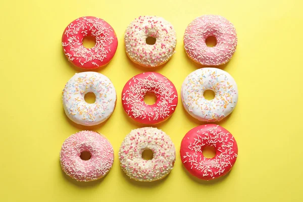 Delicious Glazed Donghnuts Color Background Top View — стоковое фото