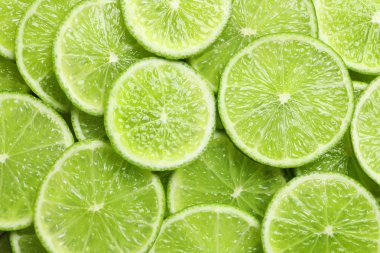 Arka plan olarak, üstten görünüm olgun limes dilimlenmiş taze