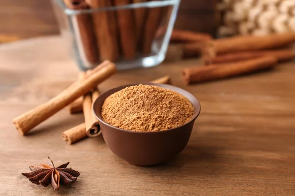 Bowl Aromatic Cinnamon Powder Sticks Wooden Table — Stock Photo, Image