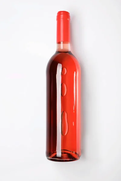 Bottle of delicious wine on white background