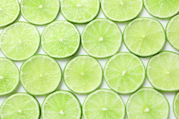 Arka Plan Olarak Üstten Görünüm Olgun Limes Dilimlenmiş Taze — Stok fotoğraf