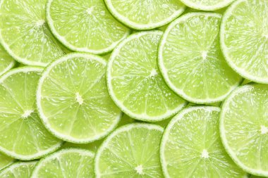 Arka plan olarak, üstten görünüm olgun limes dilimlenmiş taze