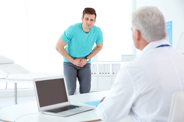 Man with health problems visiting urologist at hospital
