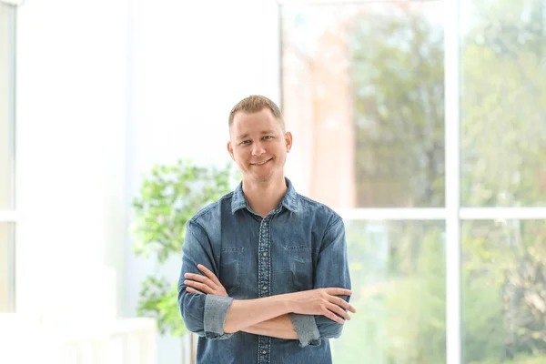 Portrait of handsome man in stylish outfit, indoors