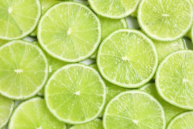 Arka plan olarak, üstten görünüm olgun limes dilimlenmiş taze