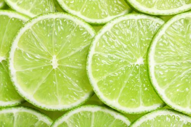 Arka plan olarak, üstten görünüm olgun limes dilimlenmiş taze