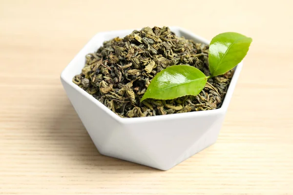 Bowl Dry Tea Green Leaves Wooden Table — Stock Photo, Image