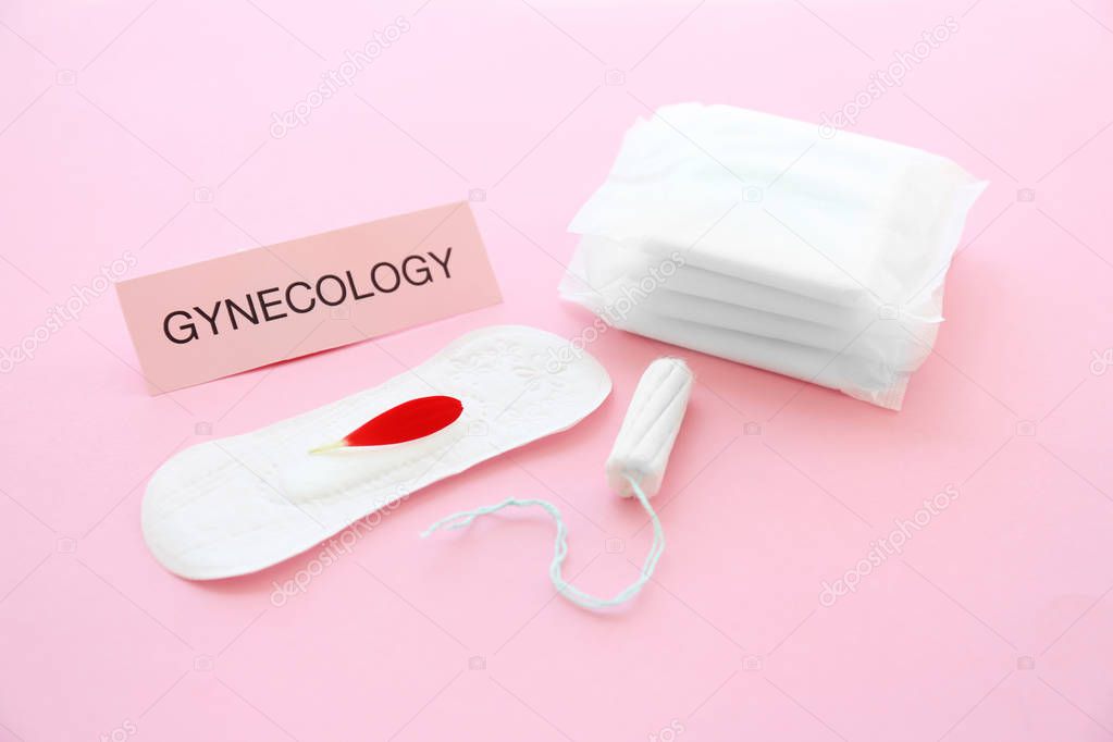 Composition with tampon and menstrual pads on color background. Gynecological care