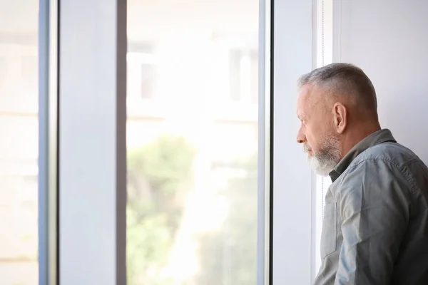 Depressed Senior Man Window Indoors — Stock Photo, Image