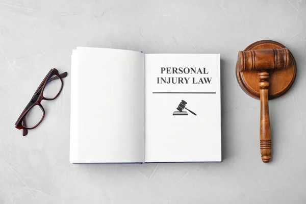 Book Words Personal Injury Law Gavel Glasses Grey Background Top — Stock Photo, Image