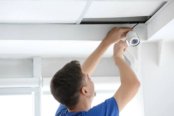 Technician Installing Cctv Camera Ceiling Indoors Stock Photo