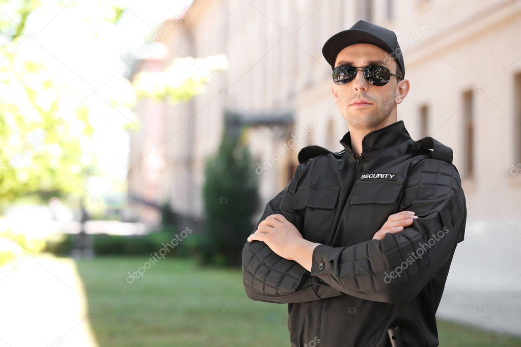 Portrait of male security guard in uniform outdoors