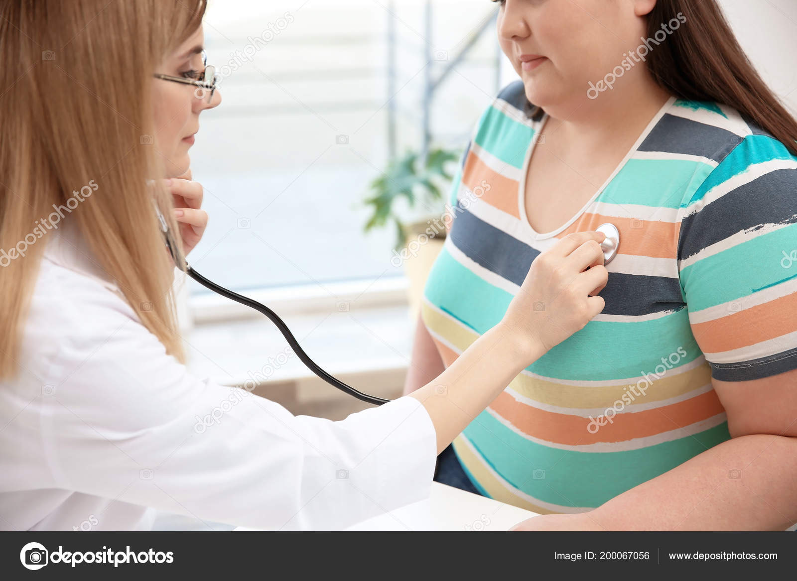 Female Doctor Listening Patient Heartbeat Stethoscope Clinic Stock Photo Image By C Newafrica