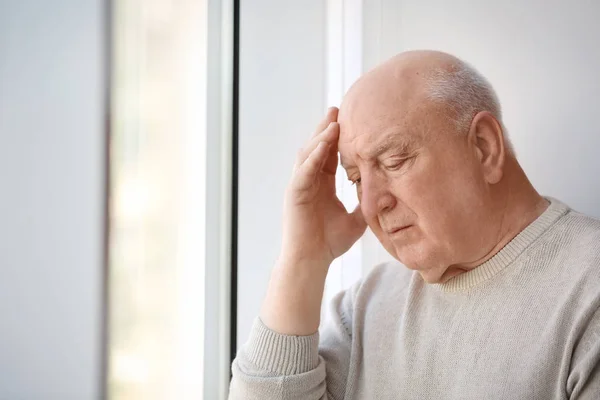 Depressed Senior Man Window Indoors — Stock Photo, Image