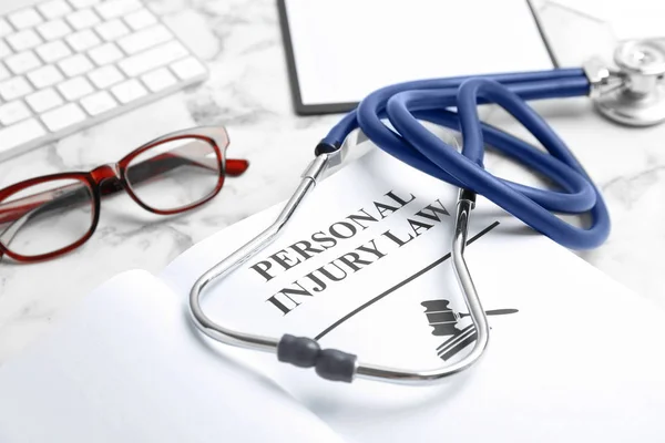 Book Words Personal Injury Law Stethoscope Table Closeup — Stock Photo, Image