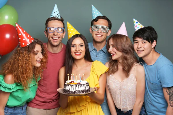 Young People Celebrating Birthday Tasty Cake Color Background — Stock Photo, Image