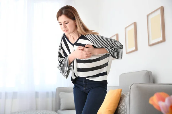 Woman having heart attack at home