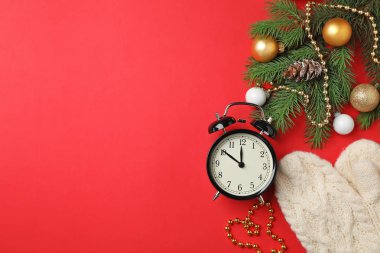 Retro alarm clock and decor on color background, top view. Christmas countdown clipart