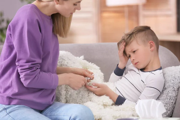 Mother Taking Care Little Son Suffering Cold Sofa — Stock Photo, Image