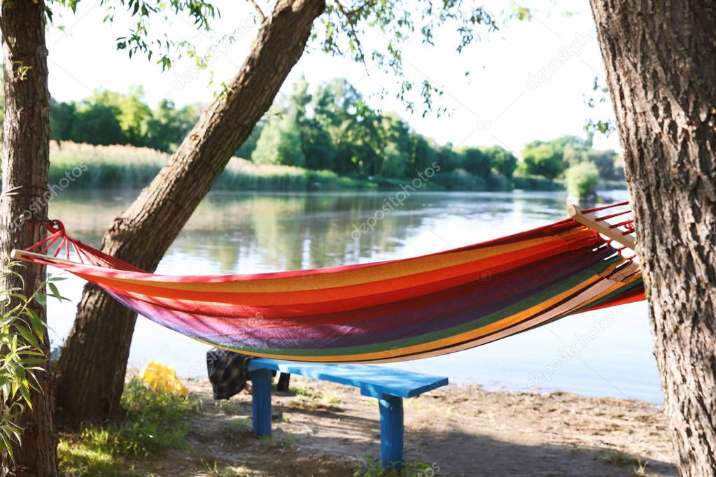 Empty hammock outdoors on sunny day. Summer camp