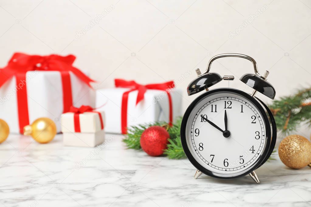 Retro alarm clock and decor on table. Christmas countdown