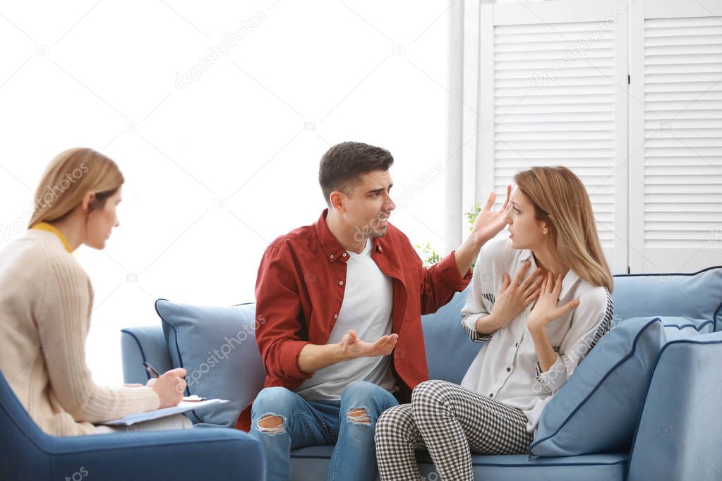 Young couple with problem at family psychologist office