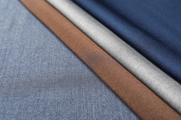 Fabric samples on cloth, closeup. Tailoring supplies