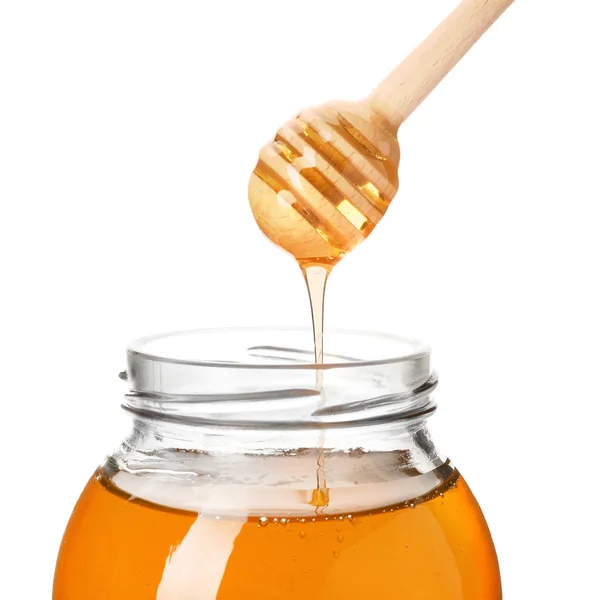 Honig Tropft Vom Löffel Ins Glas Auf Weißem Hintergrund — Stockfoto