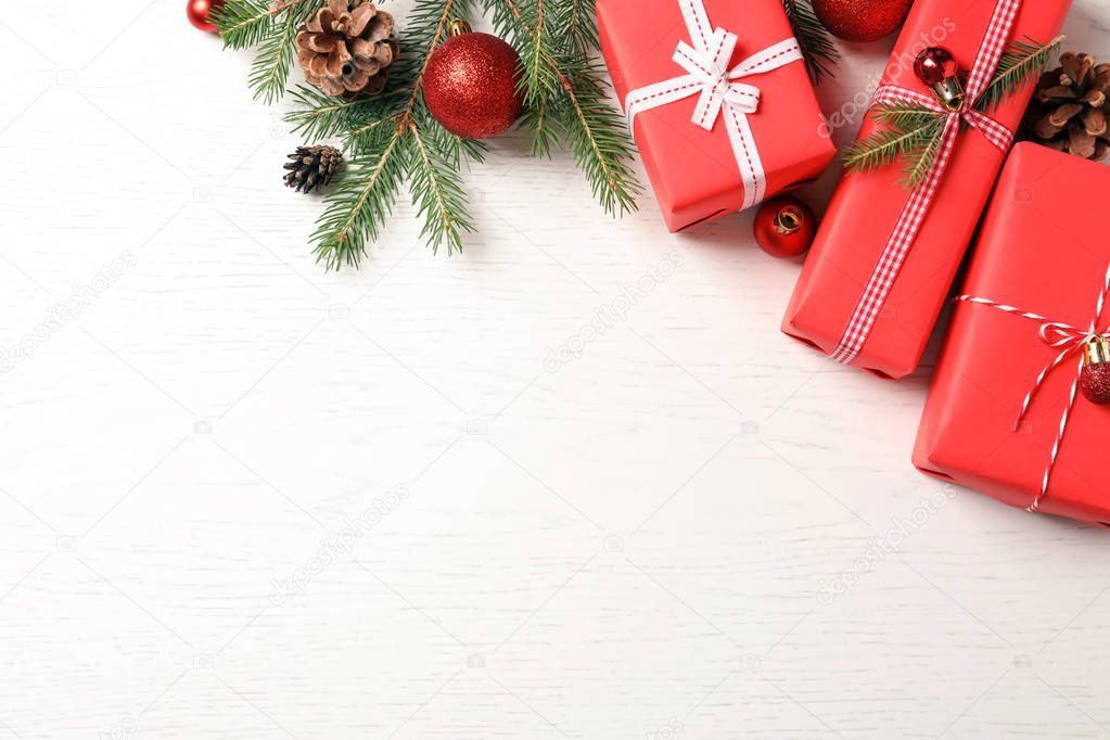 Flat lay composition with Christmas gifts on light background