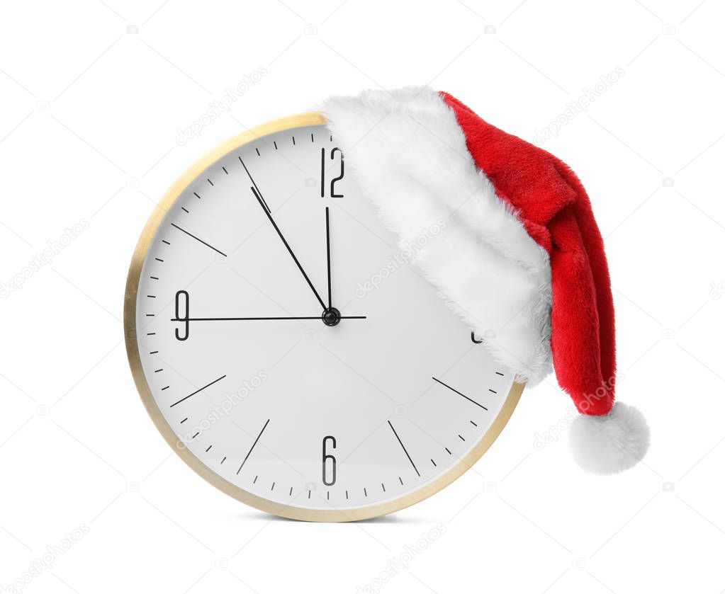 Clock with Santa hat on white background. Christmas countdown