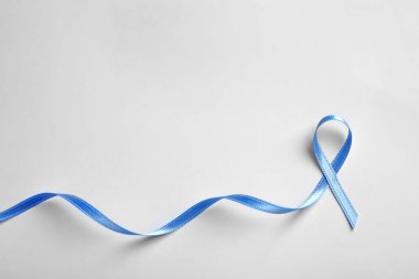 Blue ribbon on white background, top view. Cancer awareness clipart