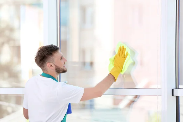 Young Man Cleaning Window Rag Indoors — Stock Photo, Image