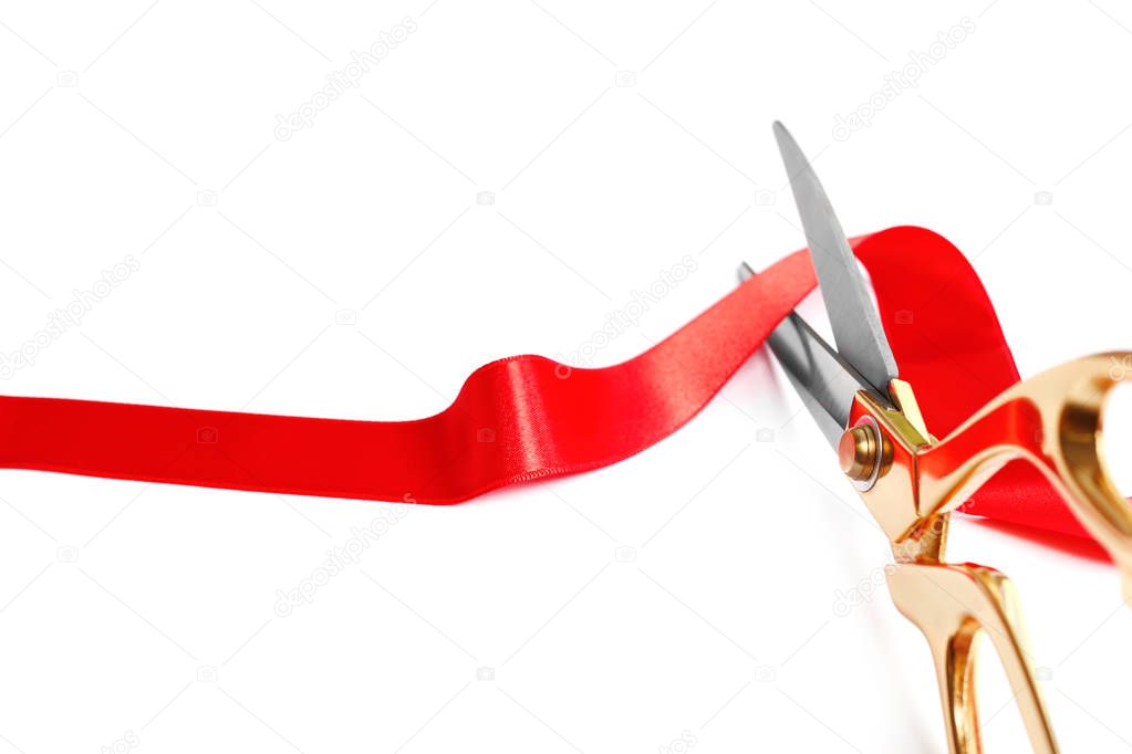 Ribbon and scissors on white background. Ceremonial red tape cutting