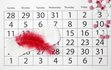 Takvim, adet yastık ve hapları düz yatıyordu kompozisyonu. Jinekolojik Check-up