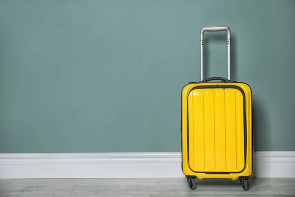 Bright Yellow Suitcase Color Wall Indoors — Stock Photo, Image