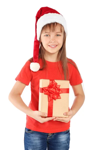 白い背景の上のクリスマス プレゼントとサンタ帽子でかわいい小さな子供 — ストック写真
