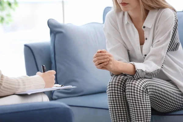 Young woman with problems at psychologist office