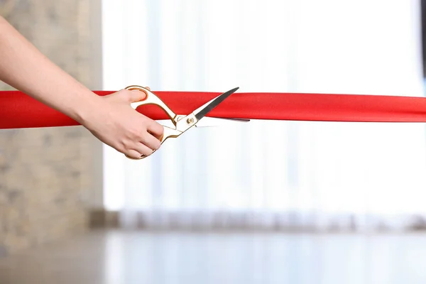 Woman Cutting Red Ribbon Blurred Background — Stock Photo, Image