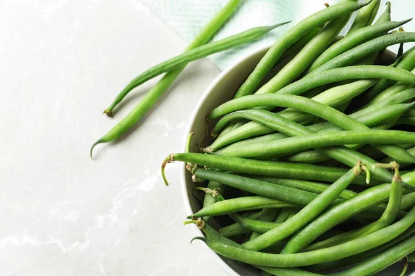 Bowl with fresh green French beans, closeup