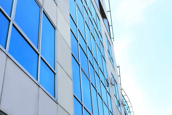 Building with tinted windows, outdoors. Modern architectural design