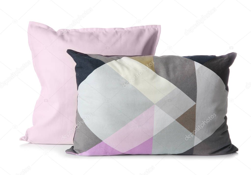 Soft decorative pillows on white background