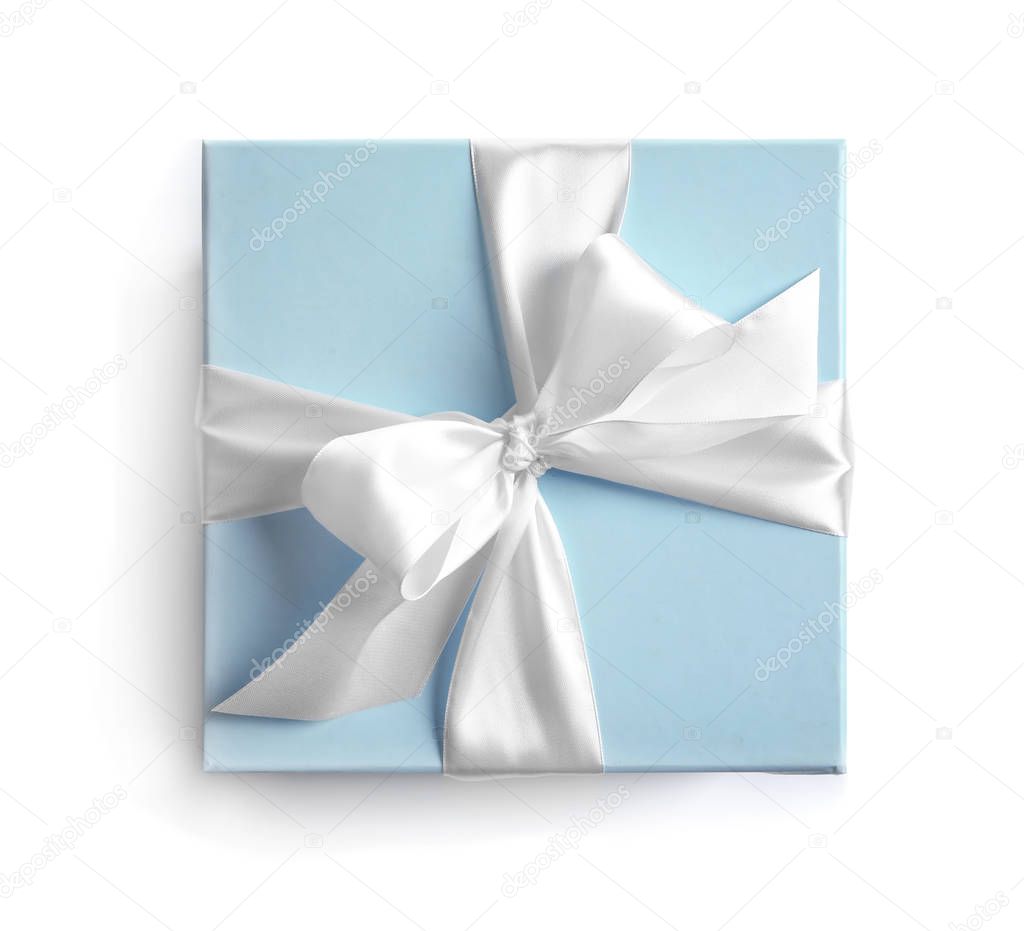 Gift box with ribbon on white background, top view